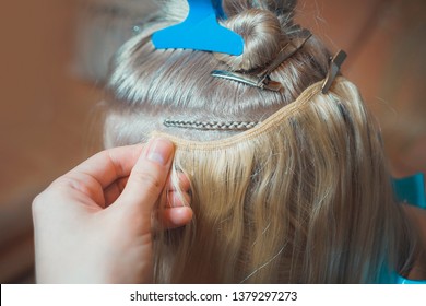 Hair Extension On Tress In Hollywood Way, African Style, Master In The Process Of Work Step By Step