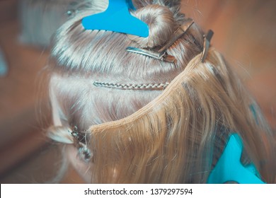 Hair Extension On Tress In Hollywood Way, African Style, Master In The Process Of Work Step By Step