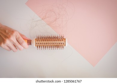 Hair Fall And Lost Alopecia Woman Problem On The Comb.