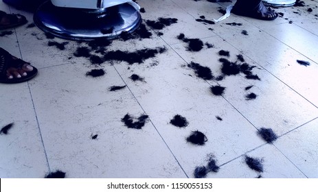 Hair falls on the floor in men's barber shop - Powered by Shutterstock