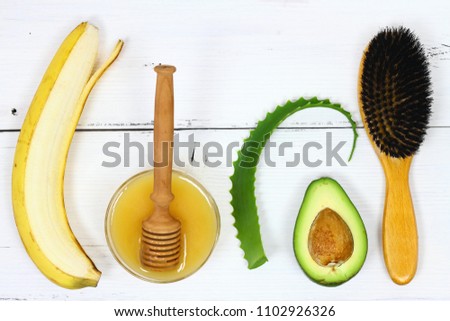 Hair mask fron banana, honey, avocado and aloe vera.  Ingredients for hair mask on the white board, top view  