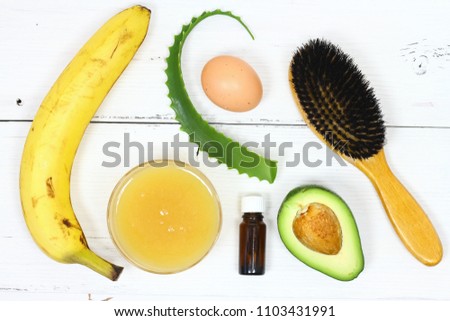 Hair mask fron banana, honey, aloe, avocado, egg. Ingredients for hair mask on the white board, top view  