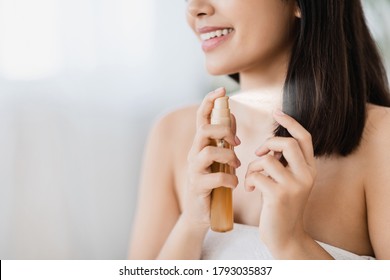 Hair Products. Closeup Of Unrecognizable Asian Girl Using Hair Spray, Copy Space