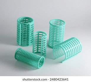 Hair rollers for hair curling, on white background. - Powered by Shutterstock