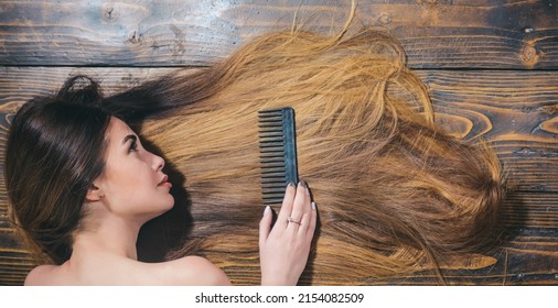 Hair salon and beauty concept. Long wavy hair of woma. Long hair style, wellness and fashion. Womans long hair texture background closeup.