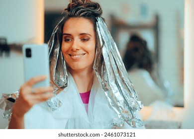 
Hair Salon Client Taking a Selfie with Foils in her Hair 
Funny woman having a sense of humor taking self portraits 
 - Powered by Shutterstock