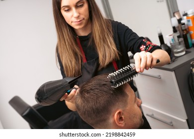 Hair Salon Master Blow Dry Hair Client At Barber Shop. Male Client Getting Haircut By Hairdresser. Hair Care, Beauty Industry, Barber Concept.
