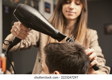 Hair salon master blow dry hair client at barber shop. Men's fashion and style. Hair care, beauty industry, barber concept. Barber shop men hairstyle. Young man getting a modern haircut. - Powered by Shutterstock