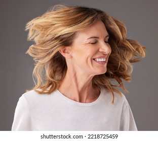 Hair, Salon And Senior Woman With Beauty, Happiness And Confidence In Gray Background Studio. Beauty Salon, Wellness And Old Woman Doing Fun Head Motion For Hairstyle, Beauty Products And Hair Care