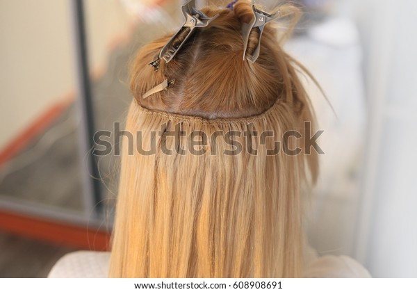 Hair is sewn on a pigtail, hair\
extensions, blond, blonde, white, strand,\
tracks