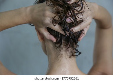 Hair Shampooing And Scalp Massage. Back View Of Woman In The Shower Cabin.