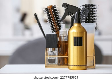 Hair spray with accessories on table in beauty salon, closeup - Powered by Shutterstock