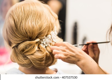 Hair Stylist Makes The Bride Before A Wedding