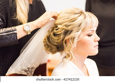 Hair Stylist Makes The Bride Before A Wedding