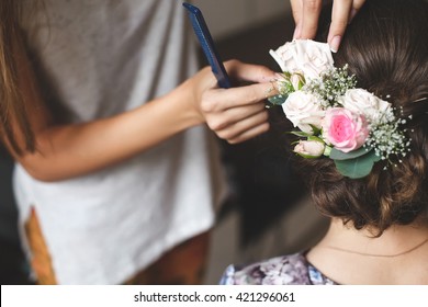 Hair Stylist Makes The Bride A Wedding Hairstyle With Fresh Flowers