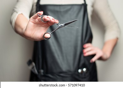 Hair Stylist With Scissors In Hand