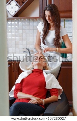 Similar – Image, Stock Photo Caregiver helping elderly female patient to get out of bed