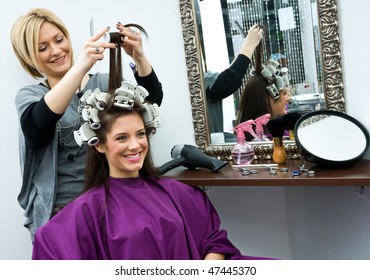 Hair Stylist Work On Happy Woman Hair In Salon