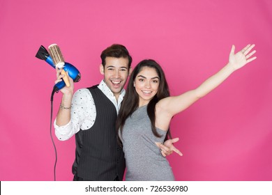 Hair Stylist Working With A Happy Customer At His Salon