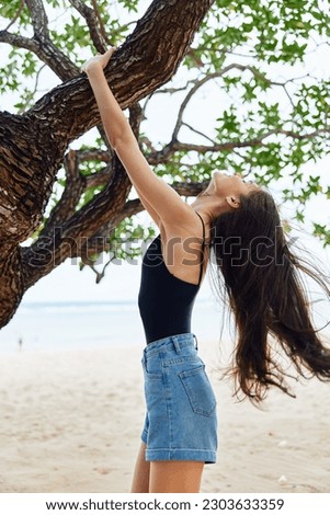 hair woman relax nature lifestyle smiling tree sea hanging sky vacation long