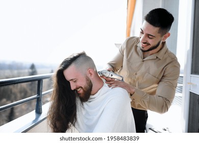 Haircut On Balcony At Home, Coronavirus And Lockdown Concept.