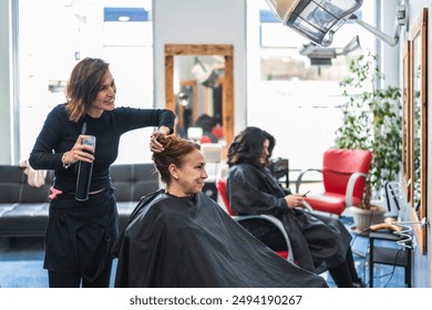 A hairdresser adjusts a client's hair in a salon, ensuring a perfect style. Concept of meticulous hair care and client focused service. - Powered by Shutterstock