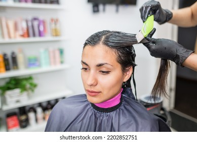 The hairdresser applies professional liquid keratin to the client's hair. A girl does keratin hair strengthening in a beauty salon. Hair care. - Shutterstock ID 2202852751