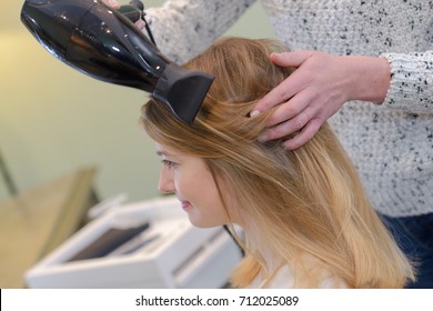 Hairdresser Blow Drying Hair