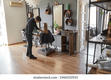 Hairdresser Is Choping Hair Of Blonde Woman Is Salon