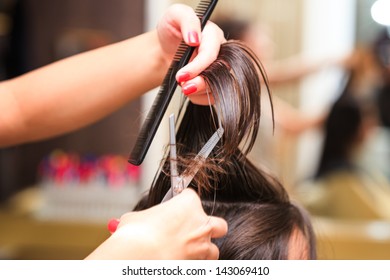 hairdresser do haircut close up indoor shot