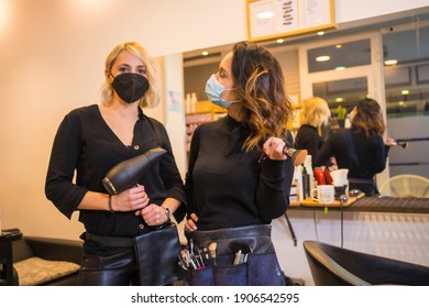 Hairdresser And Makeup Artist With Face Mask Before The Session. Security Measures Of Hairdressers In The Covid-19 Pandemic