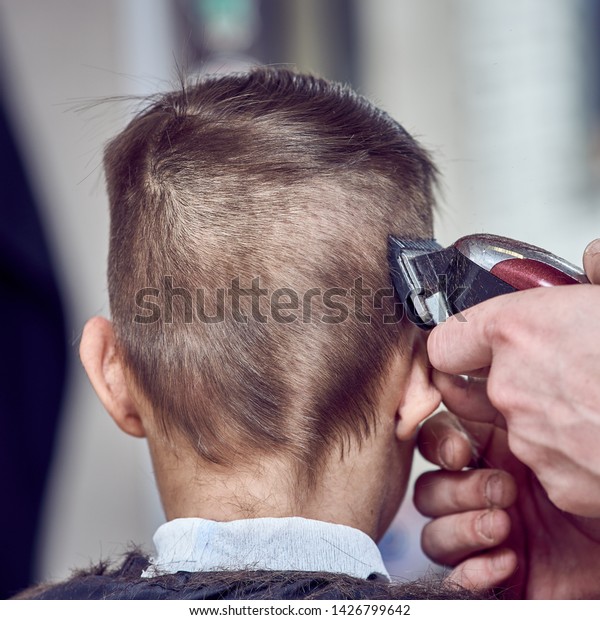 Hairdresser Making Haircut Boy Clipper Back Stock Photo Edit Now