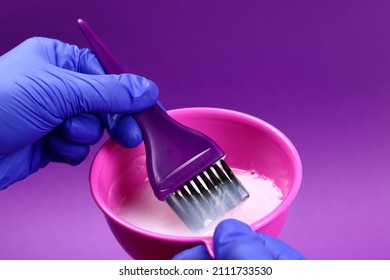 Hairdresser Mixes Hair Dye In A Plastic Bowl