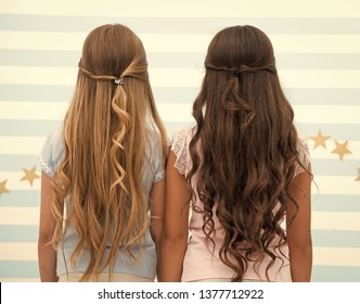 hairdresser salon services. two little girls kids with long hair at hairdresser. little girls with long curly hair. long and healthy hair. kertatine mask