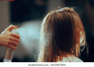 
Hairdresser Spraying a Hair Styling Product on Client Hair. High quality salon services using a heat protective product before heat styling 
 - Powered by Shutterstock