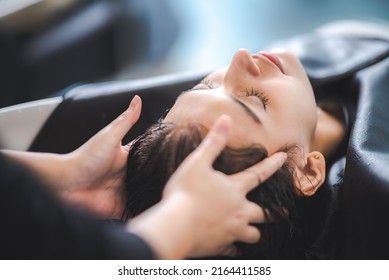 hairdresser washing client's hair at salon. happy young women customer relax and comfortable while washing hair, luxury hair spa by professional hairstylist - Shutterstock ID 2164411585