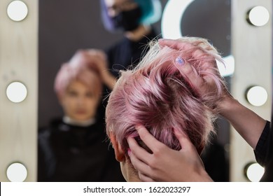 Hairdresser Woman Cuts Her Hair To A Woman's Blonde Woman. Short Haircut, Pixie Or Bob.