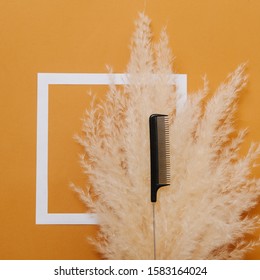 Hairdresser's Rat Tail Comb Placed Over Fluffy Dry Cereal Bouquet. Top View. Over Orange Background With White Square On It.