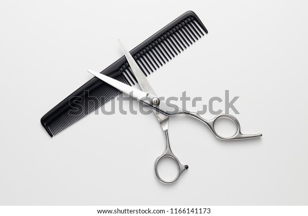 Hairdressers Scissors Comb On White Background Royalty Free