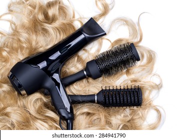hairdressers  tools on a background of the  blond hair