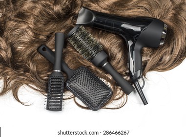 Hairdressers Tools On A Background Of The Brown Hair