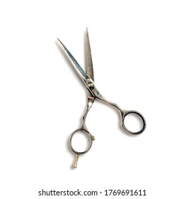 Hairdressing scissors isolated on a white background. Beauty and fashion. Objects.
