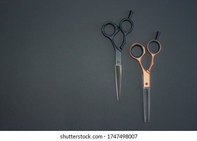 Hairdressing Scissors. A Pair Of Clippers And Thinning. Black And Rose Gold. Solid Black Background. Base, Banner, Postcard.