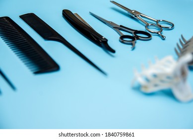 Hairdressing Tools On A Blue Background Side View