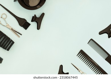 Hairdressing tools scissors combs on  pastel green blue background. Horizontal template with hair salon accessories and copy space - Powered by Shutterstock