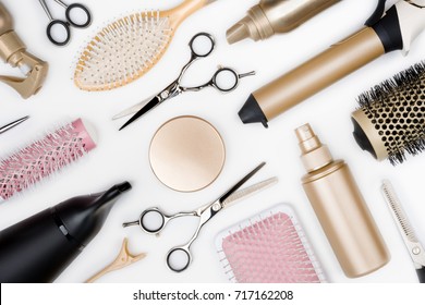 Hairdressing tools and various hairbrushes on white background top view - Powered by Shutterstock