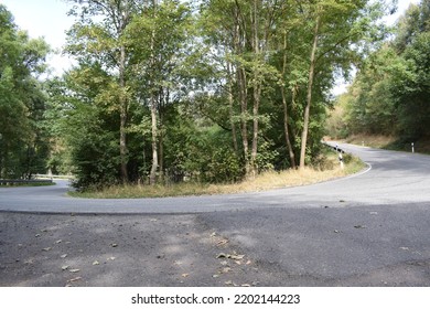 Hairpin Curve Of An Eifel Road In The Forest