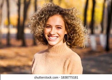 Hairstyle Curly Hair, Portrait Of A Young Beautiful Girl In An Autumn Park