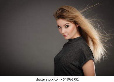 Hairstyle and haircare concept. Portrait of blonde charming attractive young lady with open waving hair. Woman with healthy and beauty hairdo coiffure. - Shutterstock ID 545962951