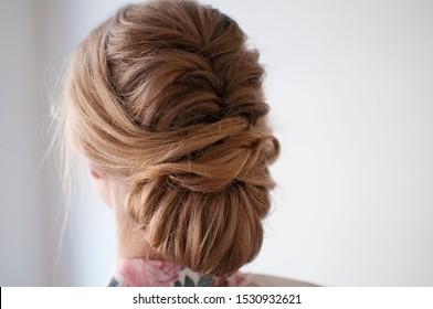 Hairstyle For Wedding, Loose Updo Partly Made Of Braid, Blonde Girl Shot From The Back On A White Background.